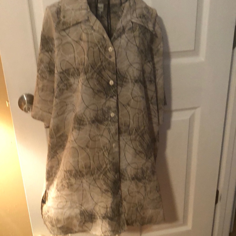 Woman’s buttoned up shirt.